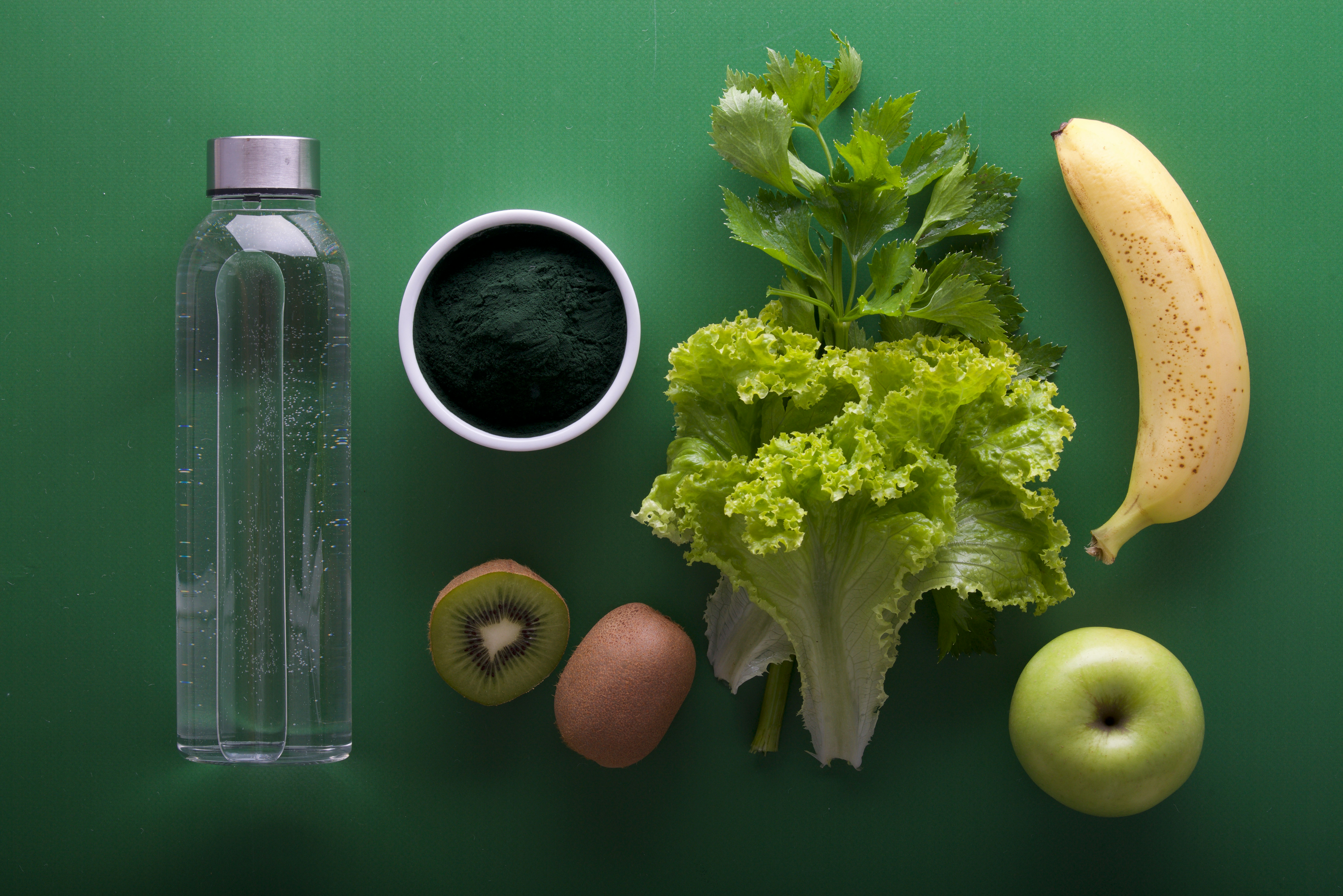 Water bottle, kiwi fruit, lettuce, banana, and apple